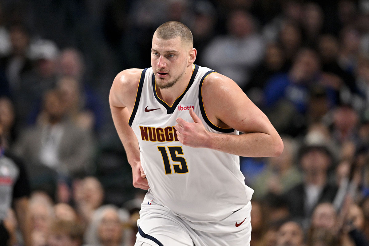     Denver Nuggets center Nikola Jokic (15) runs down the court during the second quarter against the Dallas Mavericks at the American Airlines Center.