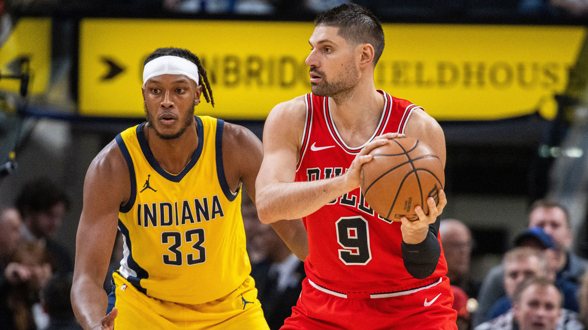 Chicago Bulls center Nikola Vucevic (9) looks to pass while Indiana Pacers center Myles Turner (33) defends in the second half at Gainbridge Fieldhouse.