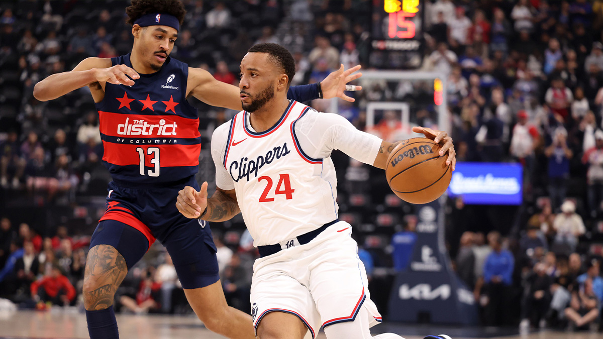 Los Angeles Clippers guard Norman Powell (24) drives against Washington Wizards guard Jordan Poole (13) during the first half at the Intuit Dome.