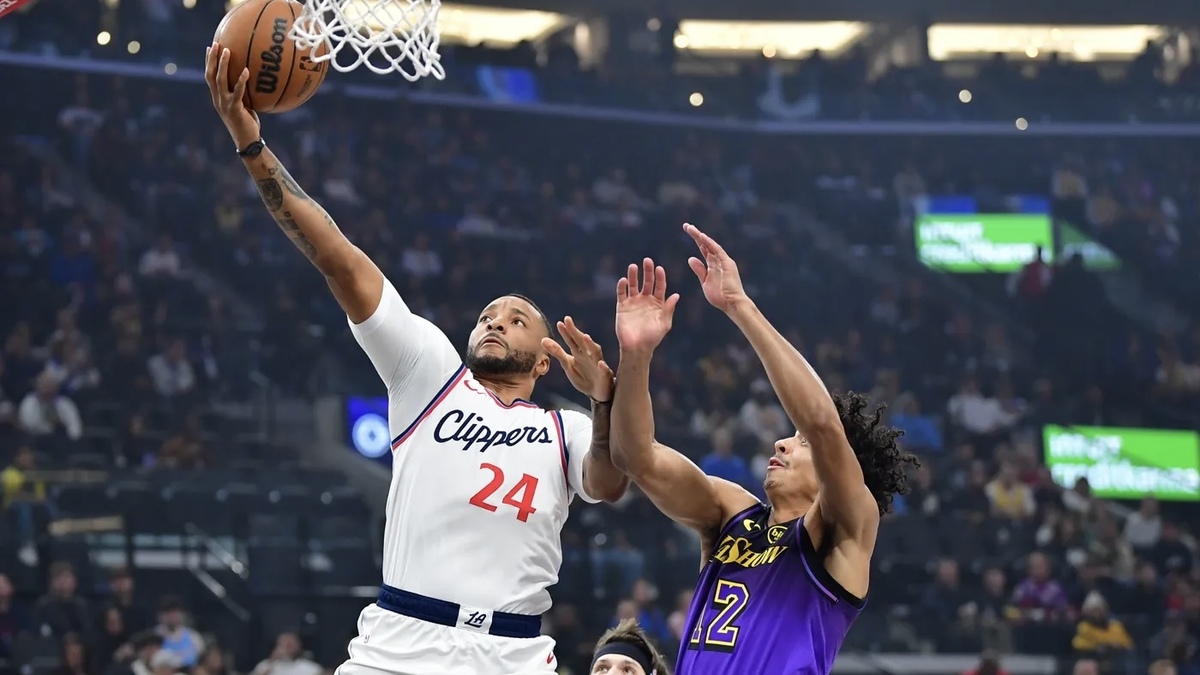 Los Angeles Clippers guard Norman Powell (24) shoots against Los Angeles Lakers guard Max Christie (12) during the first half at Intuit Dome.