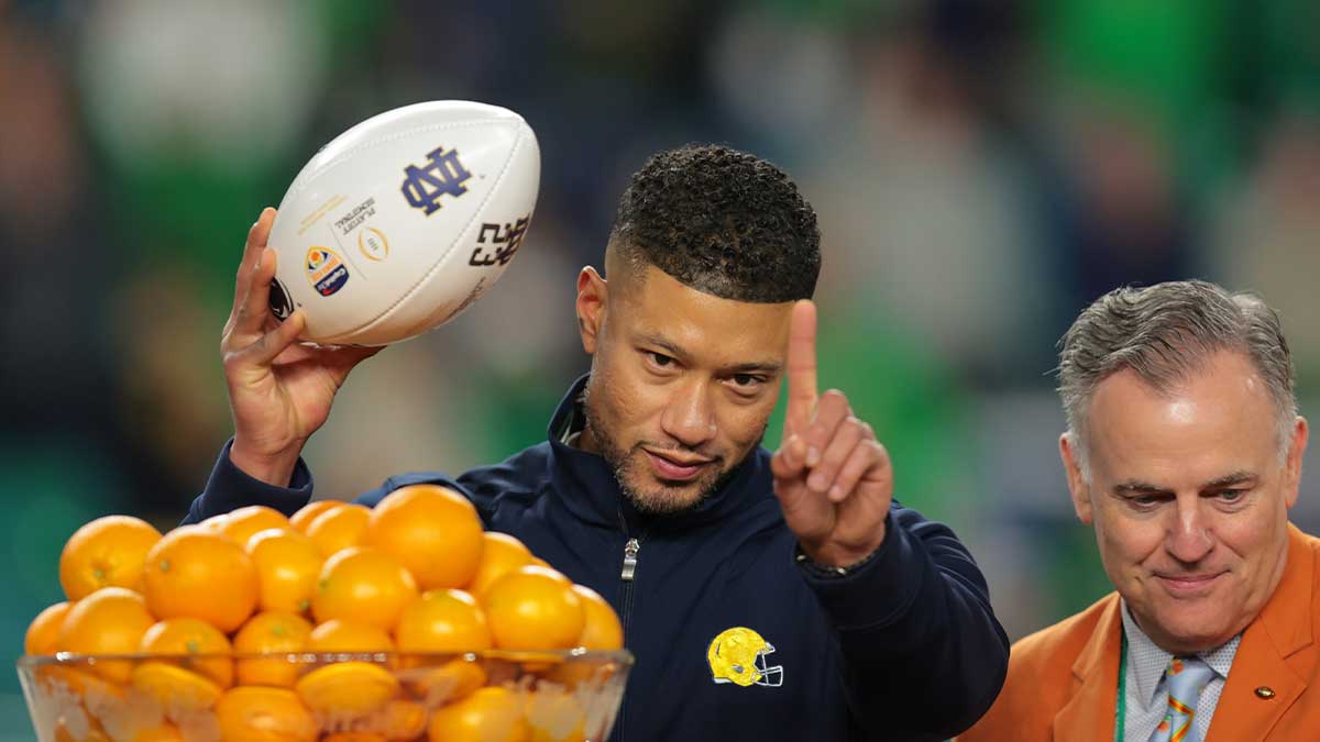 Notre Dame Fighting Irish head coach Marcus Freeman celebrates defeating the Penn State Nittany Lions in the Orange Bowl at Hard Rock Stadium.