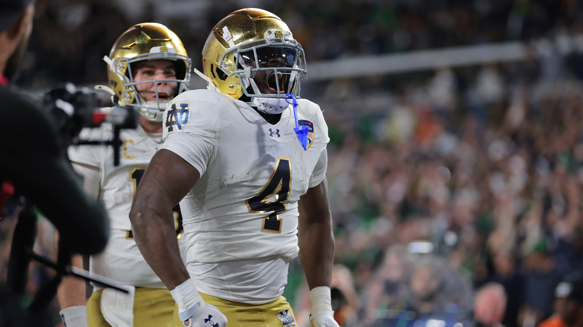 Notre Dame Fighting Irish running back Jeremiiah Love (4) celebrates a touchdown in the second half against the Penn State Nittany Lions in the Orange Bowl at Hard Rock Stadium.