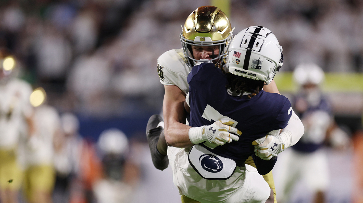 Notre Dame Fighting Irish safety Luke Talich (28) tackles Penn State Nittany Lions wide receiver Kaden Saunders (7) during a second half return in the Orange Bowl at Hard Rock Stadium. 