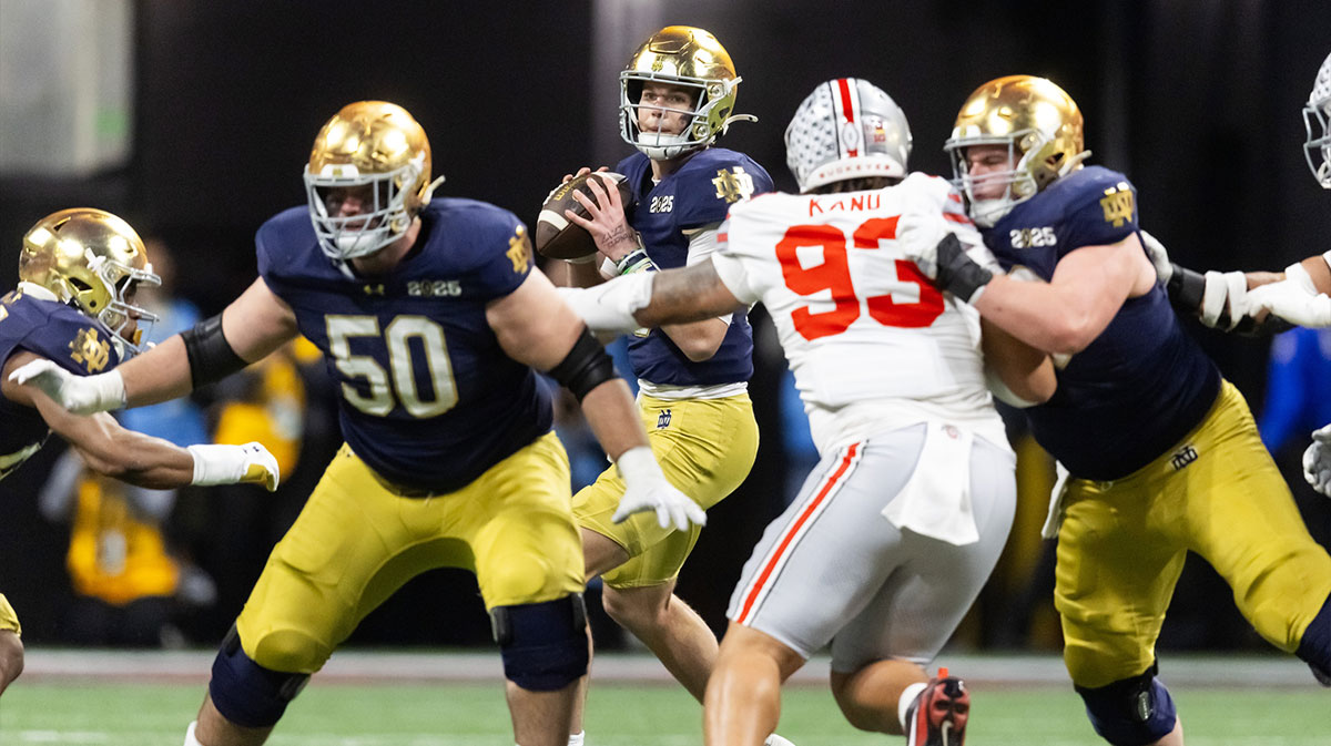Notre Dame Fighting Irish quarterback Riley Leonard (13) against the Ohio State Buckeyes during the CFP National Championship college football game at Mercedes-Benz Stadium.