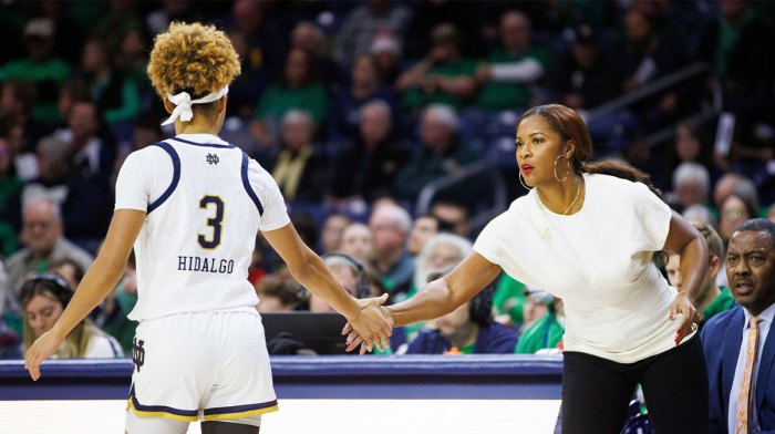 Notre Dame head coach Niele Ivey, right, slaps hands with guard Hannah Hidalgo (3) during a NCAA women's basketball game between No. 3 Notre Dame and Wake Forest.
