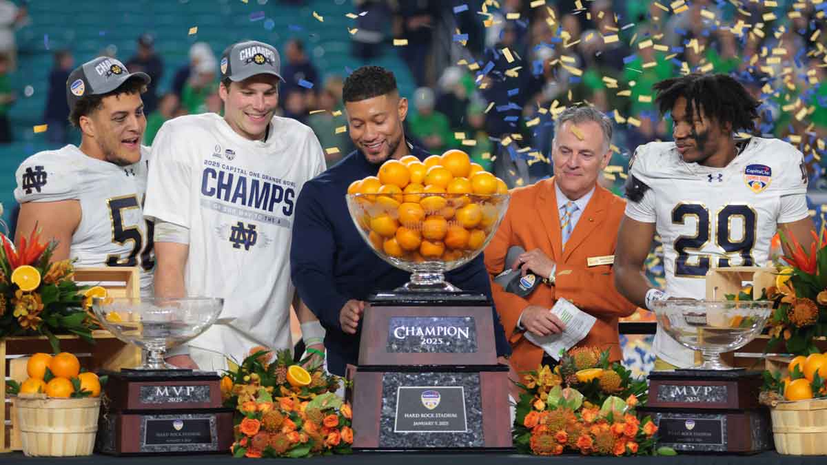 Notre Dame Fighting Irish coach Marcus Freeman and quarterback Riley Leonard (13) celebrate their victory over the Penn State Nittany Lions in the Orange Bowl at Hard Rock Stadium.