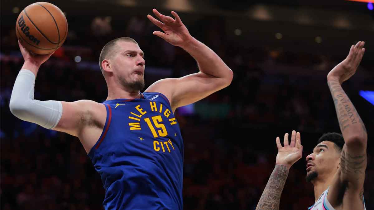 Denver Nuggets center Nikola Jokic (15) protects the basketball from Miami Heat center Kel'el Ware (7) during the first quarter at Kaseja Center.