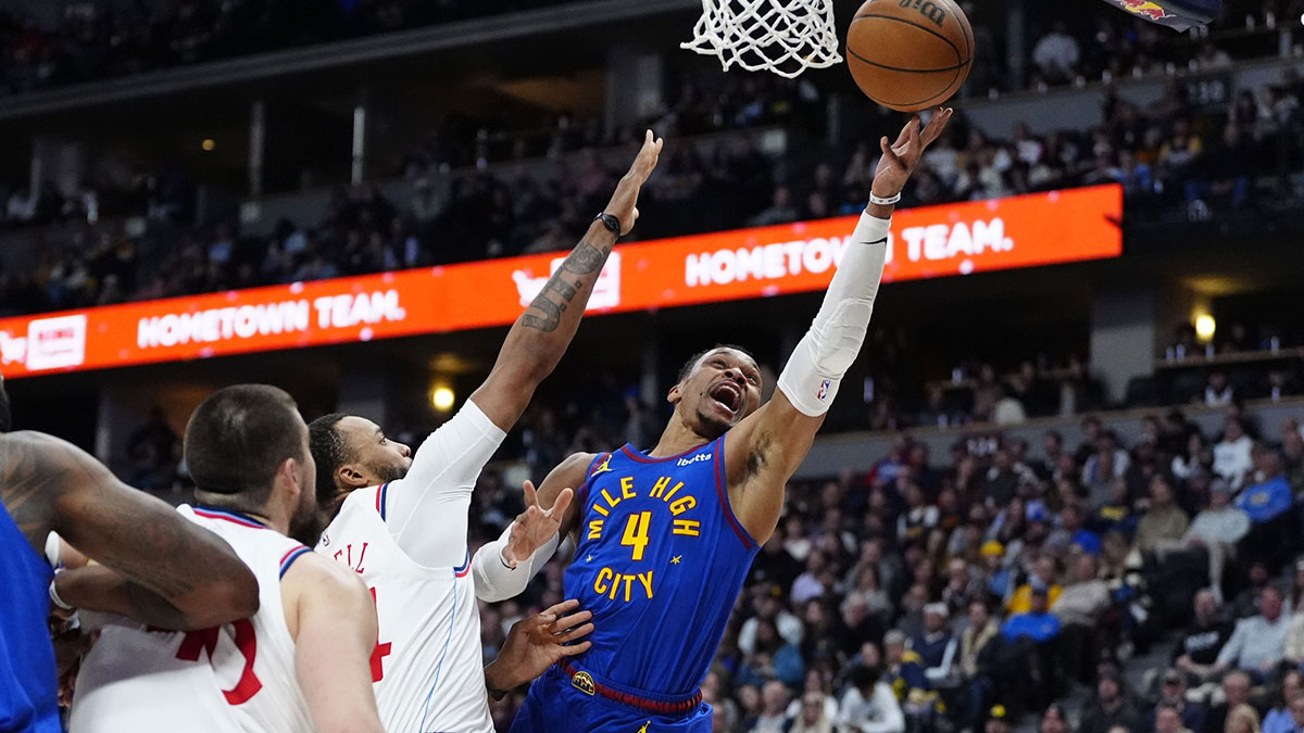 Nuggets guard Russell Westbrook (4) shoots a layup