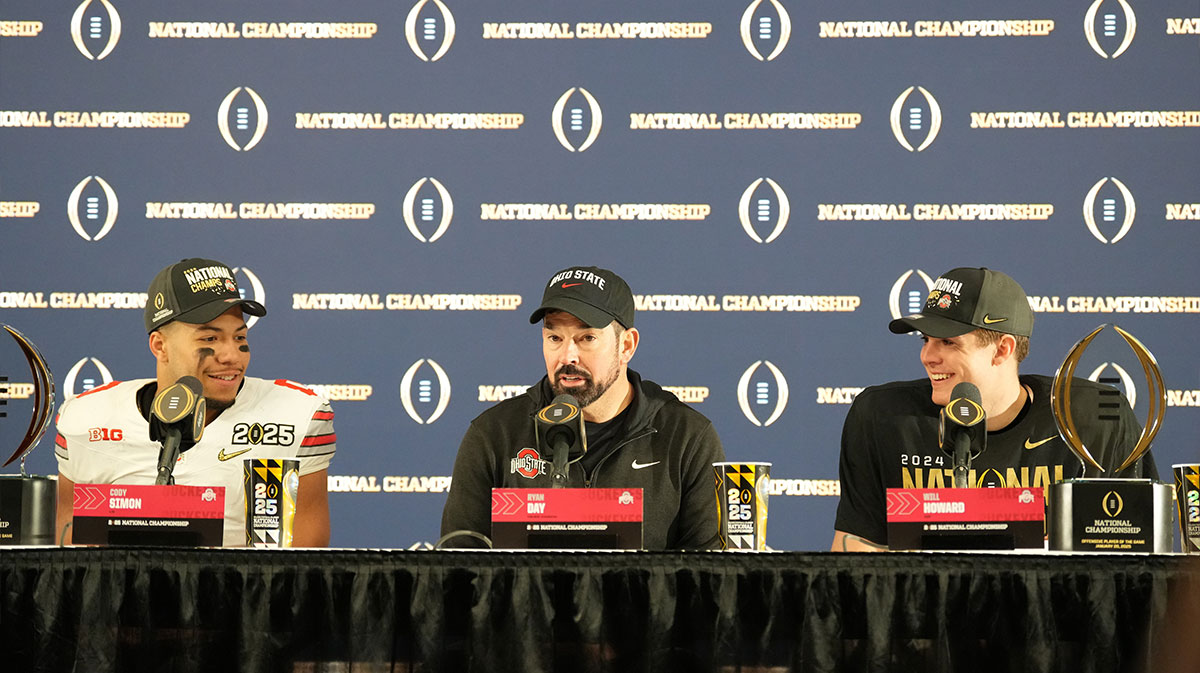 Ohio State Buckeyes head coach Ryan Day is interviewed with Cody Simon and Will Howard after defeating the Notre Dame Fighting Irish in the CFP National Championship college football game at Mercedes-Benz Stadium.