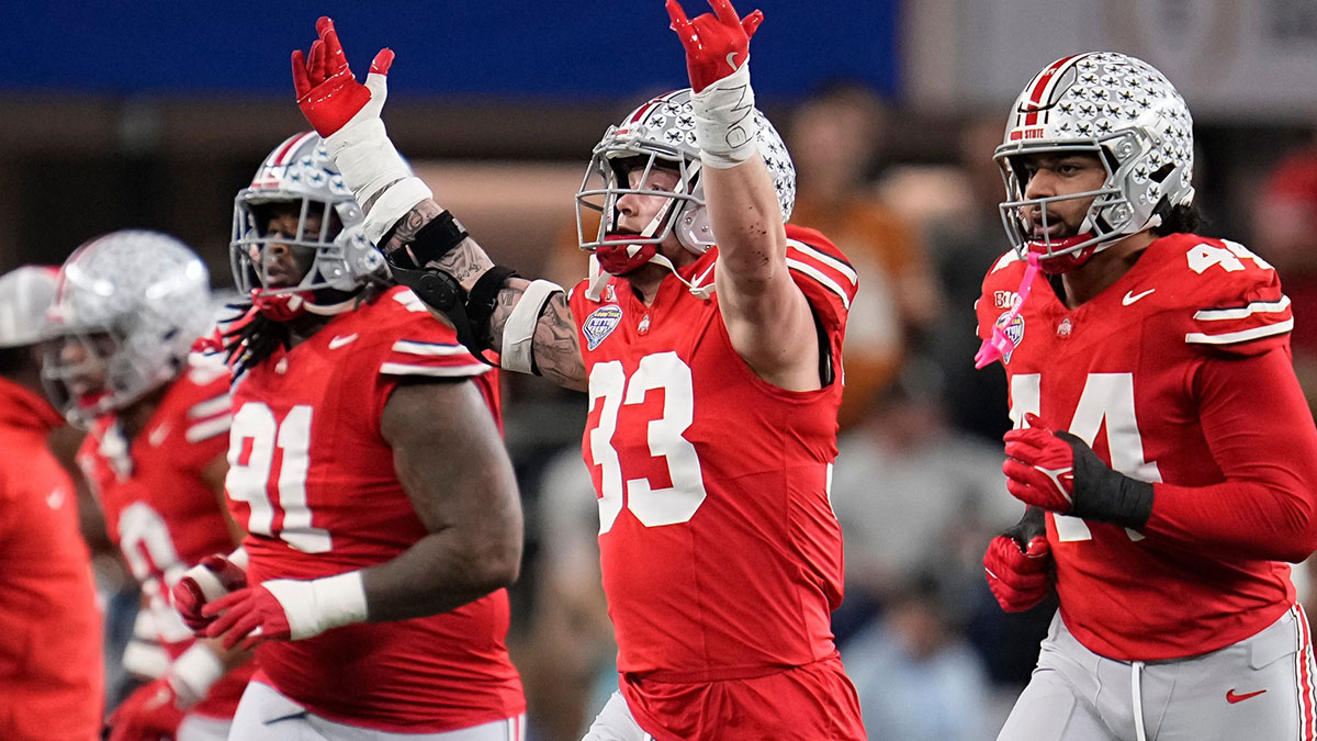 Ohio State Buckeyes defensive end Jack Sawyer (33) celebrates a fourth down during the first half of the Cotton Bowl Classic College Football Playoff semifinal game against the Texas Longhorns at AT&T Stadium in Arlington, Texas on January 10, 2025.