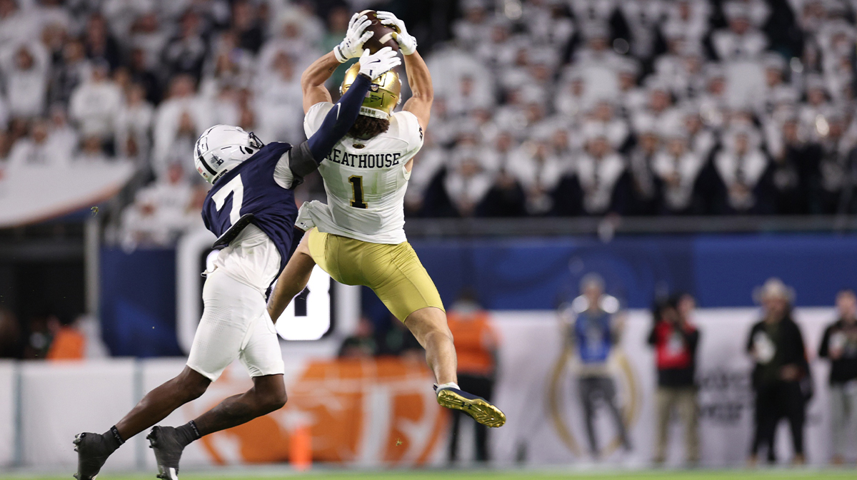 receiver Jaden Greathouse (1) leaps for the ball pressured by Penn State Nittany Lions cornerback Zion Tracy (7) in the second half in the Orange Bowl at Hard Rock Stadium. 