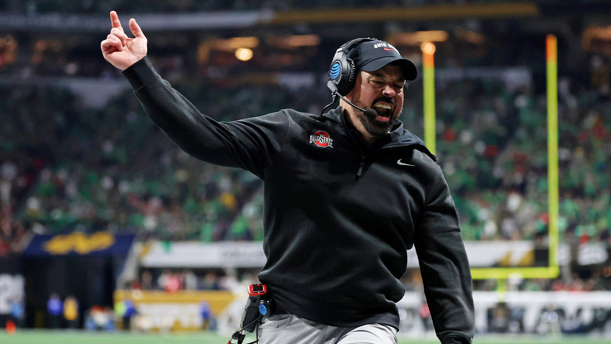 Ohio State Buckeyes head coach Ryan Day celebrates after a play against the Notre Dame Fighting Irish during the second half the CFP National Championship college football game at Mercedes-Benz Stadium.
