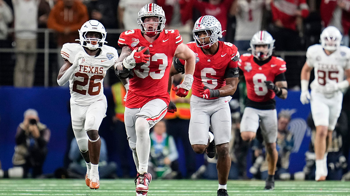 Ohio State Buckeyes defensive end Jack Sawyer (33) fumbles for a touchdown after sacking Texas Longhorns quarterback Quinn Evers (3) during the second half of the Cotton Bowl Classic College Football Playoff semifinal game at AT&T Stadium in Arlington, Texas, January. 10, 2025. Sawyer returned the fumble for a touchdown, and Ohio State won 28-14.