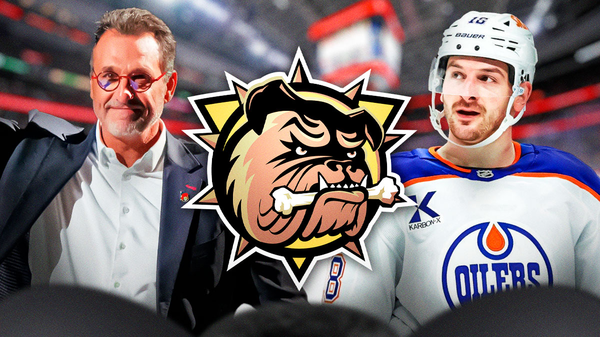 Zach Hyman on right. Michael Andlauer on left. Hamilton Bulldogs logo in middle