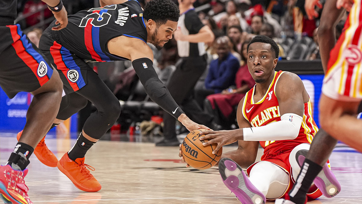 Atlanta Hawks guard Bogdan Bogdanovic (13) is guarded by New York Knicks forward OG Anunoby (8) and guard Cameron Payne (1) during the second half at Madison Square Garden.