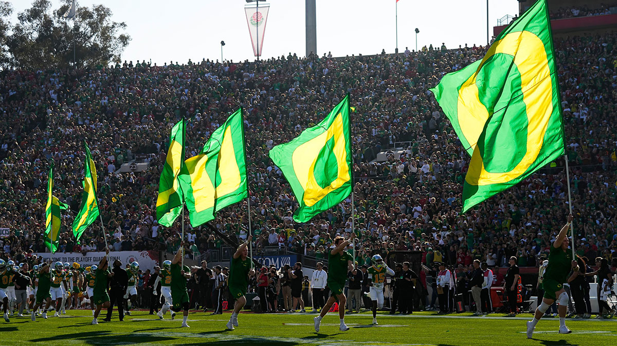 The Oregon Ducks take the field for the College Football Playoff quarterfinal against the Ohio State Buckeyes at the Rose Bowl in Pasadena, Calif. on Jan. 1, 2025.