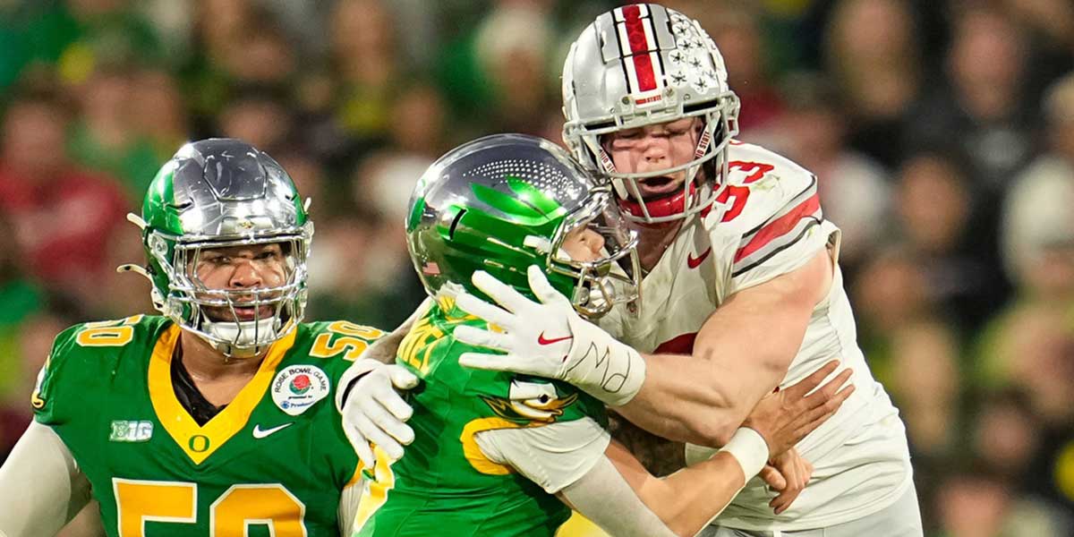 Ohio State Buckeyes defensive end Jack Sawyer (33) hits Oregon Ducks quarterback Dillon Gabriel (8) during the second half of the College Football Playoff quarterfinal at the Rose Bowl in Pasadena, Calif. on Jan. 1, 2025. Ohio State won 41-21.