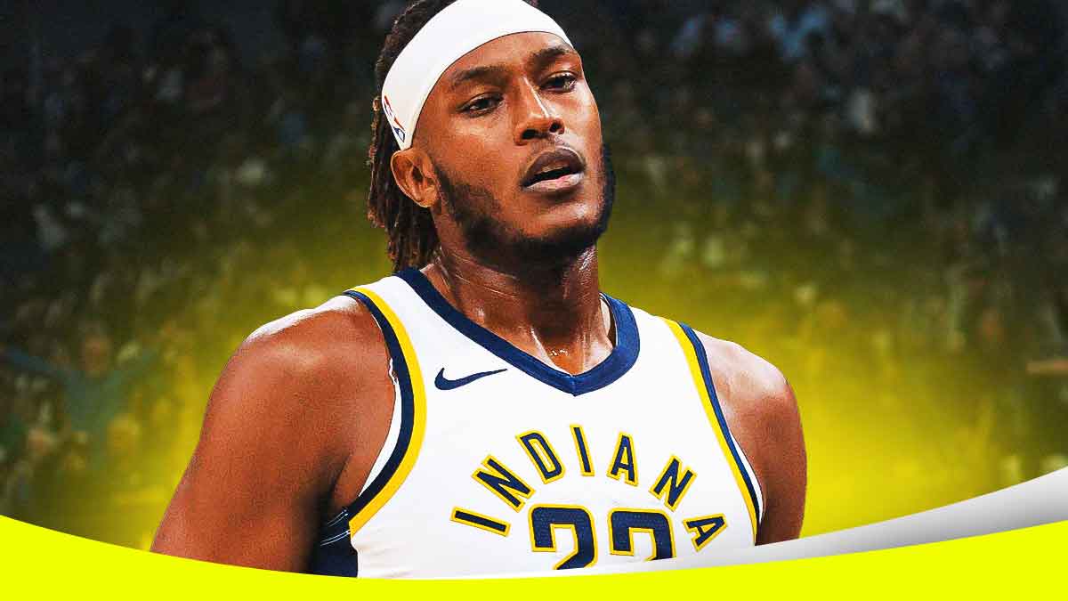 Indiana Pacers player Myles Turner with the Pacers arena in the background, baby