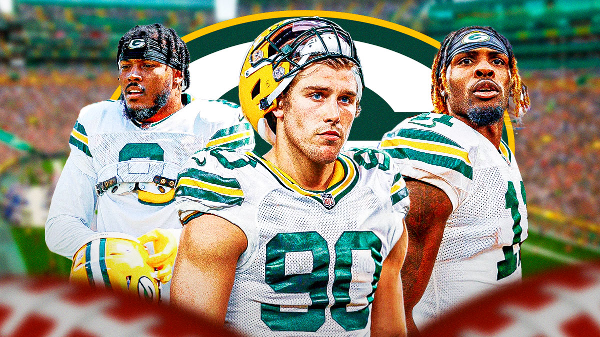 Lukas Van Ness in the middle, Josh Jacobs, Jayden Reed around him, Green Bay Packers wallpaper in the background