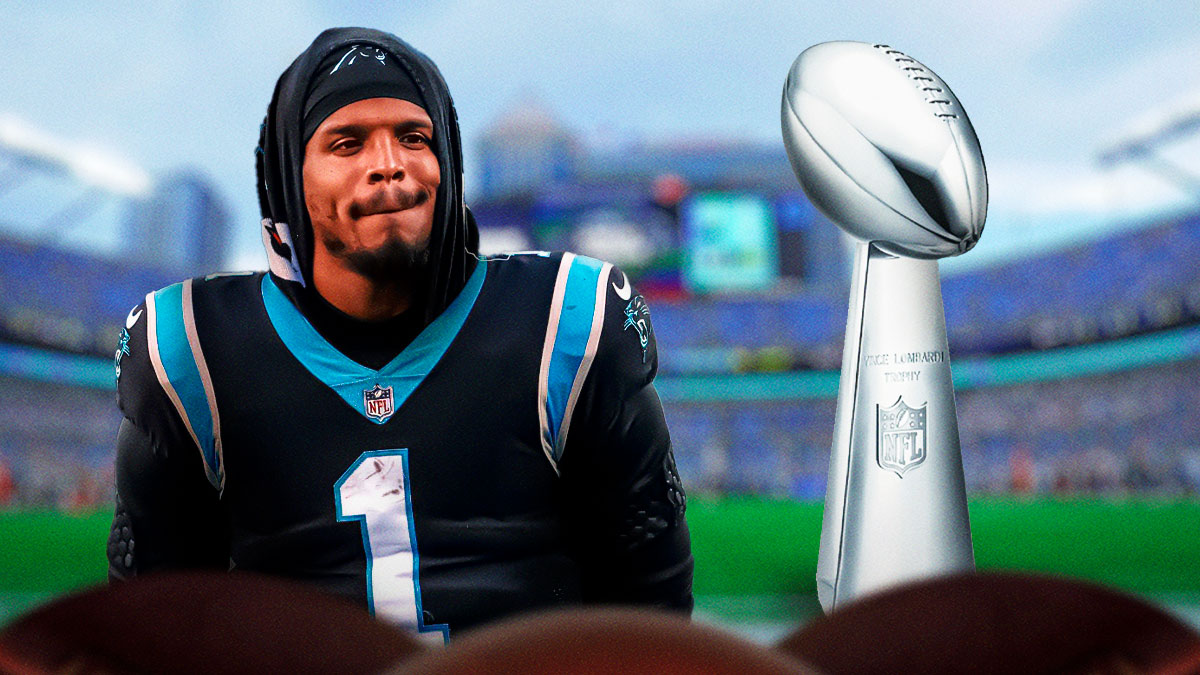Former Carolina Panthers quarterback Cam Newton next to the Lombardi Trophy