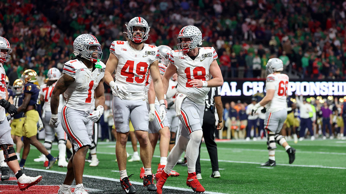 Ohio State Buckeyes running back Quinshon Judkins (1), tight end Patrick Gurd (49), and quarterback Will Howard (18) celebrate after a touchdown against the Notre Dame Fighting Irish during the second half the CFP National Championship college football game at Mercedes-Benz Stadium.