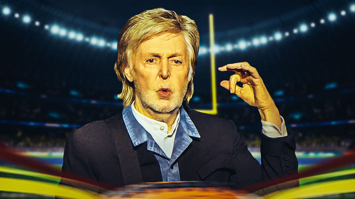 Paul McCartney, a fan of American football and has been to the Super Bowl, with NFL stadium behind him.