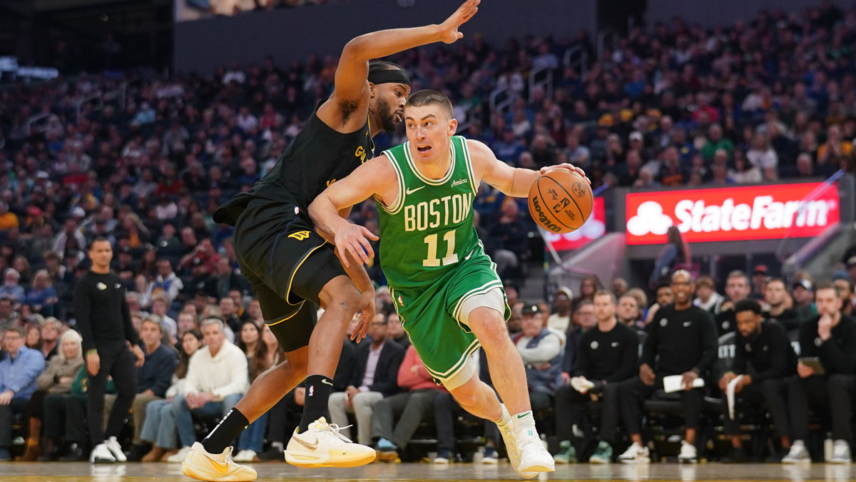 Boston Celtics guard Payton Pritchard (11) dribbles past Golden State Warriors guard Moses Moody (4) in the second quarter at the Chase Center.
