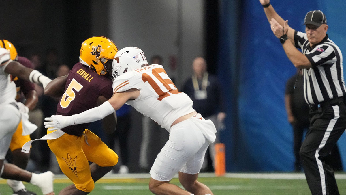 Arizona State wide receiver Melquan Stovall (5) is tackled by Texas defensive back Michael Taaffe (16) after a catch during the fourth quarter in the Chick-fil-A Peach Bowl in Atlanta on Jan. 1, 2025. The play was reviewed for targeting but was not called. Gene Steratore disagreed.