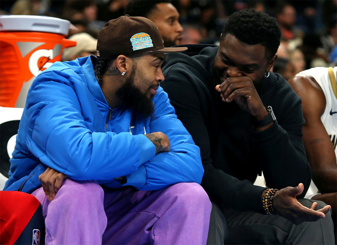 Pelicans forward Zion Williamson (right) talks with forward Brandon Ingram (left) on the bench during the second half against the Memphis Grizzlies at FedExForum