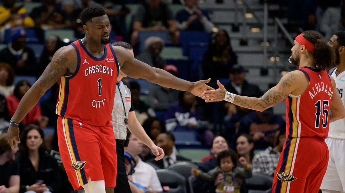 Pelicans Zion Villiamson (1) celebrates with New Orleans Pelicants Guard Jose Alvarado (15) v. Dallas Mavericks during the first half at the center of Smoothie King Center