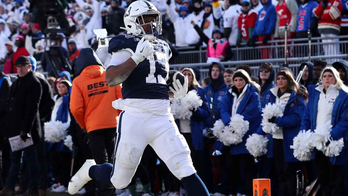 Penn State Nittany Lions running back Kaytron Allen (13) runs the ball into the end zone for a touchdown during the second quarter against the Southern Methodist Mustangs in the first round of the College Football Playoff at Beaver Stadium. 