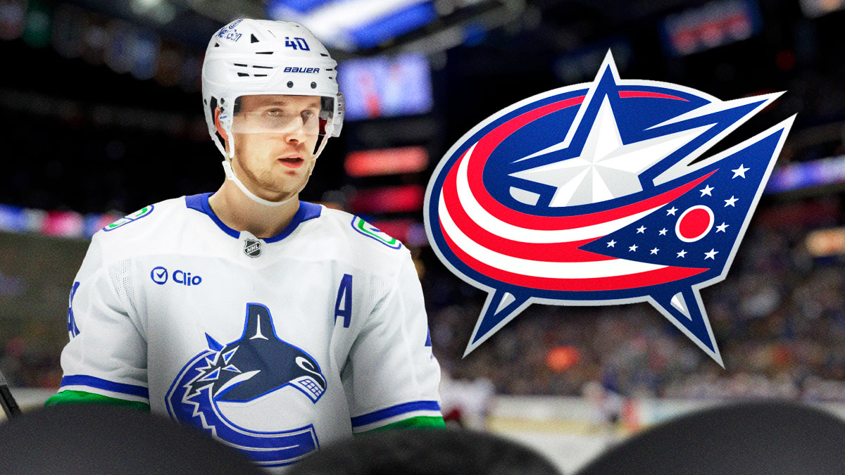 Elias Pettersson next to Blue Jackets logo