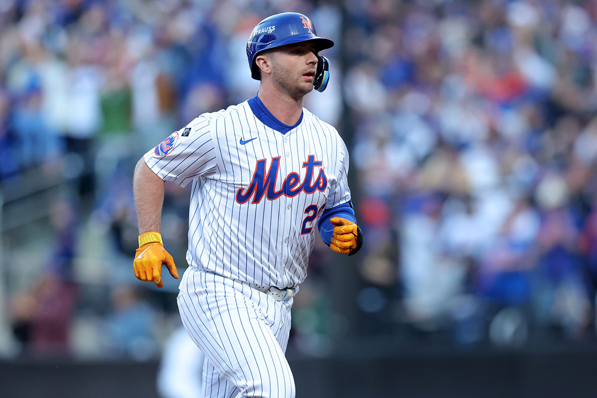 New York Mets first baseman Pete Alonso (20) rounds the bases after hitting a three run home run against the Los Angeles Dodgers during the first inning of game five of the NLCS during the 2024 MLB playoffs at Citi Field.