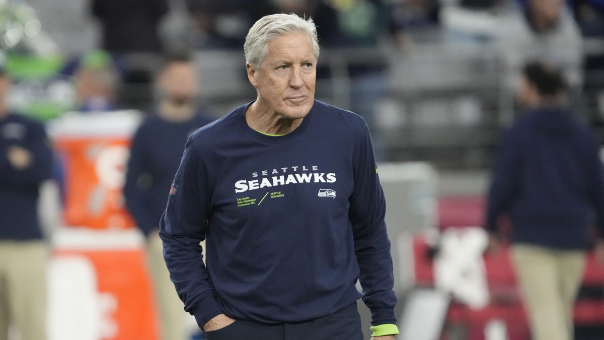 Seattle Seahawks head coach Pete Carroll watches his team warm up before playing against the Arizona Cardinals