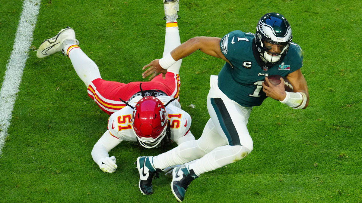 Eagles quarterback Jalen Hurts scrambles for extra yardage during the first half of Super Bowl 57 against the Chiefs on Feb. 12, 2023.