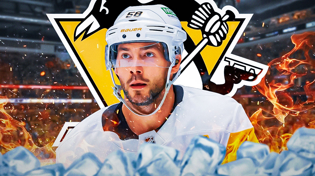 Kris Letang looking happy with fire around him, Pittsburgh Penguins logo, hockey rink in background