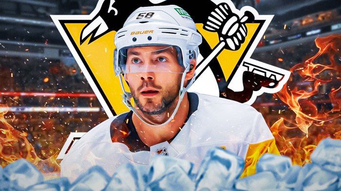Kris Letang looking happy with fire around him, Pittsburgh Penguins logo, hockey rink in background