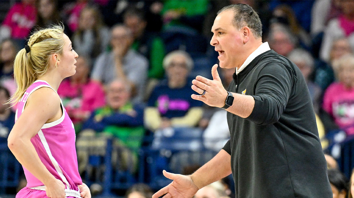 Pittsburgh Panthers head coach Tory Verdi talks to guard Marley Washenitz (11) in the first half against the Notre Dame Fighting Irish.