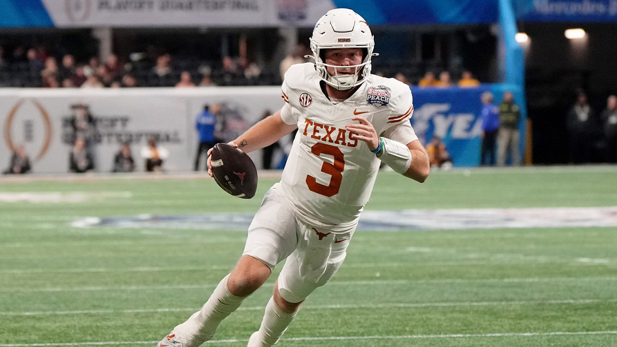 Jan 1, 2025; Atlanta, GA, USA; Texas Longhorns quarterback Quinn Ewers (3) runs with the ball for a touchdown against the Arizona State Sun Devils during the second half of the Peach Bowl at Mercedes-Benz Stadium.