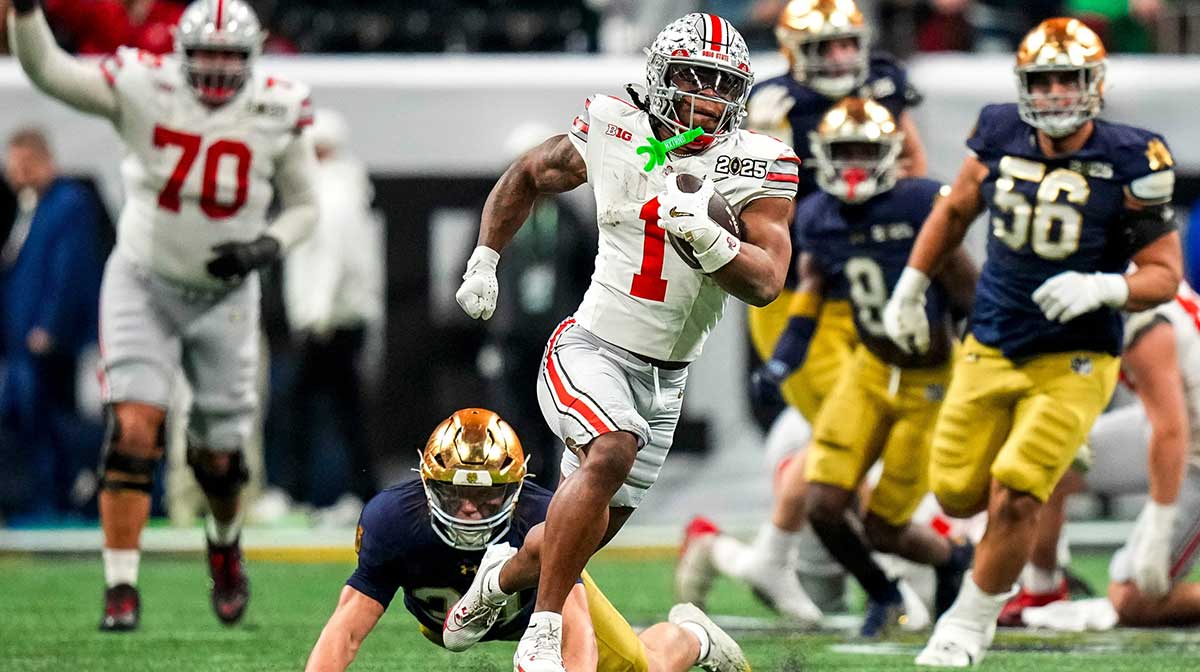 Ohio State Buckeyes running back Quinshon Judkins (1) runs the ball against the Notre Dame Fighting Irish during the College Football Playoff championship at Mercedes-Benz Stadium