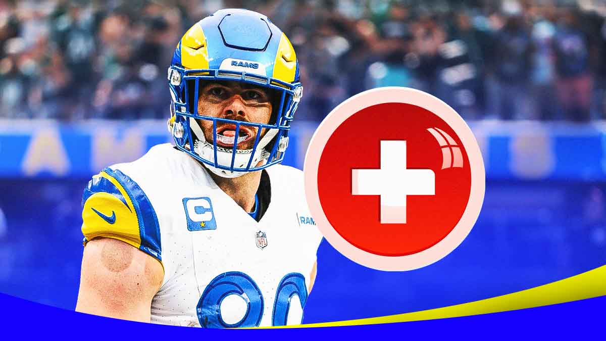 Tyler Higbee in a Los Angeles Rams uniform with a red and white first aid symbol as Higbee left the playoff game against the Vikings with an injury.