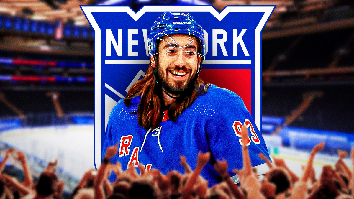 Mika Zibanejad looking happy, New York Rangers logo, hockey rink in background