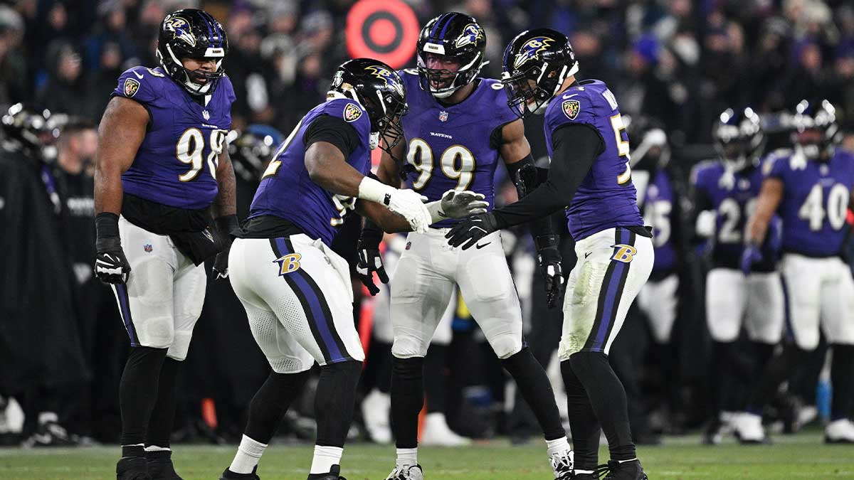 Baltimore Ravens defensive tackle Nnamdi Madubuike (92) celebrates with linebacker Kyle Van Noy (53) and linebacker Odafe Oweh (99) after a tackle against the Pittsburgh Steelers in the third quarter in an AFC wild card game at M&T Bank Stadium.