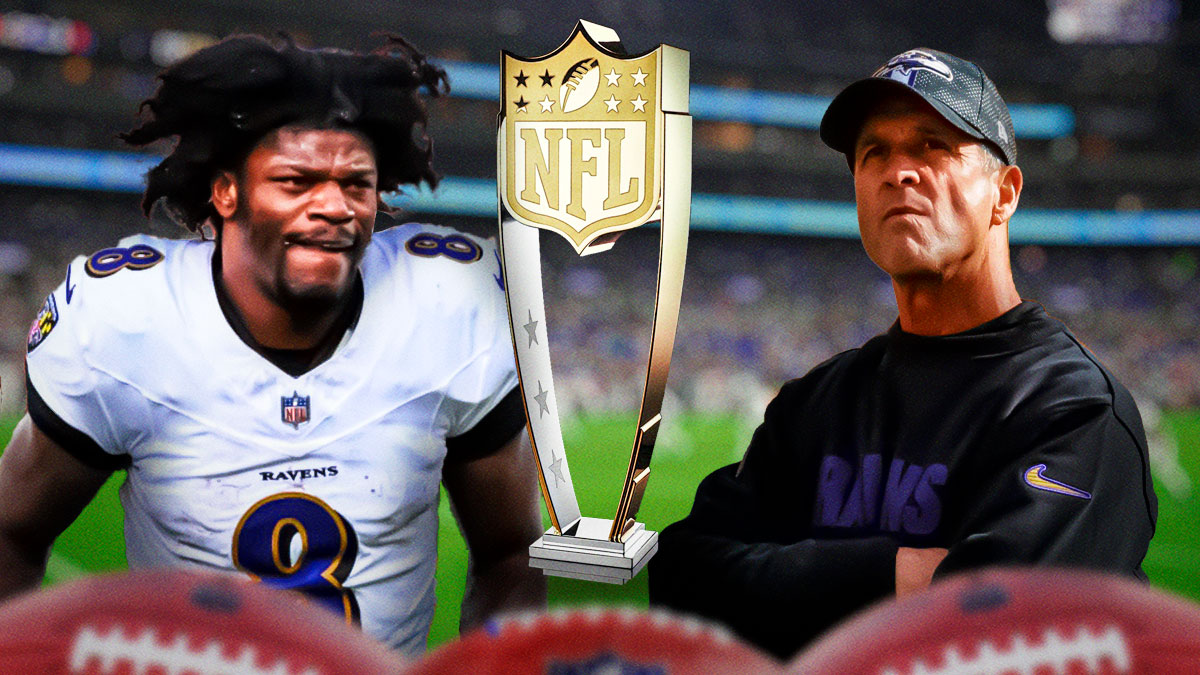 The NFL MVP Trophy in between Baltimore Ravens quarterback Lamar Jackson and head coach John Harbaugh