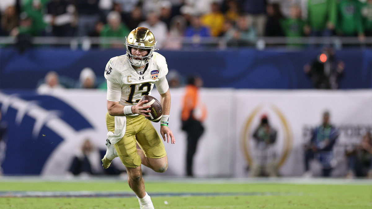 Notre Dame Fighting Irish quarterback Riley Leonard (13) runs the ball in the second half against the Penn State Nittany Lions in the Orange Bowl at Hard Rock Stadium.