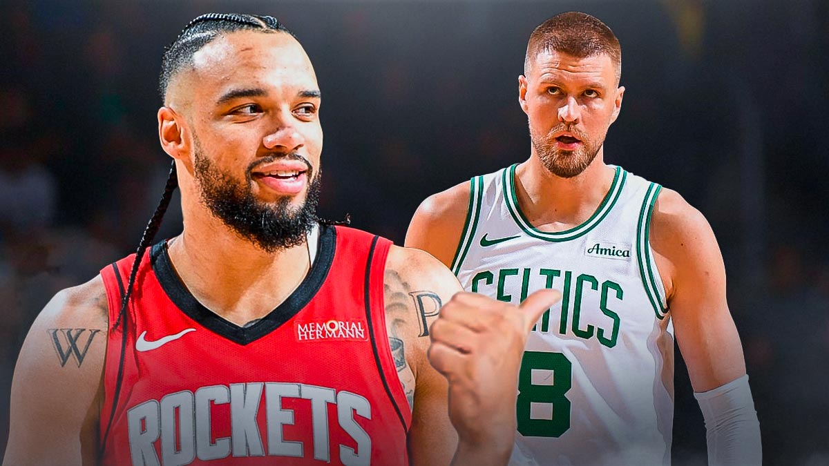 Rockets' Dillon Brooks laughing at Celtics' Kristaps Porzingis, with Brooks' thumb pointing at Porzingis