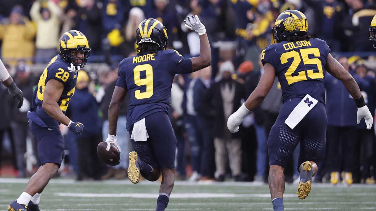 Michigan Wolverines defensive back Rod Moore (9) celebrates after he makes an interception in the second half against the Ohio State Buckeyes at Michigan Stadium.