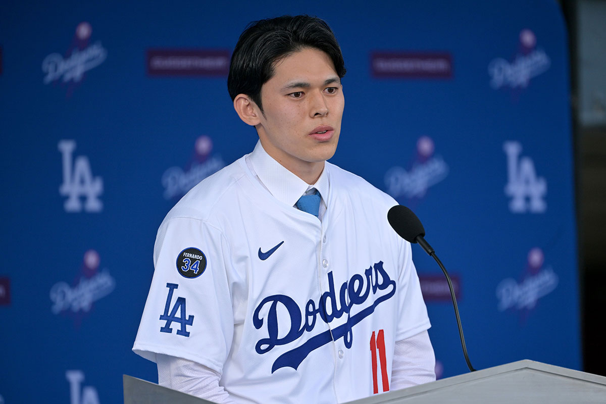 Los Angele Dodgers pitcher Roki Sasaki (11) speaks during an introductory press conference at Dodger Stadium.