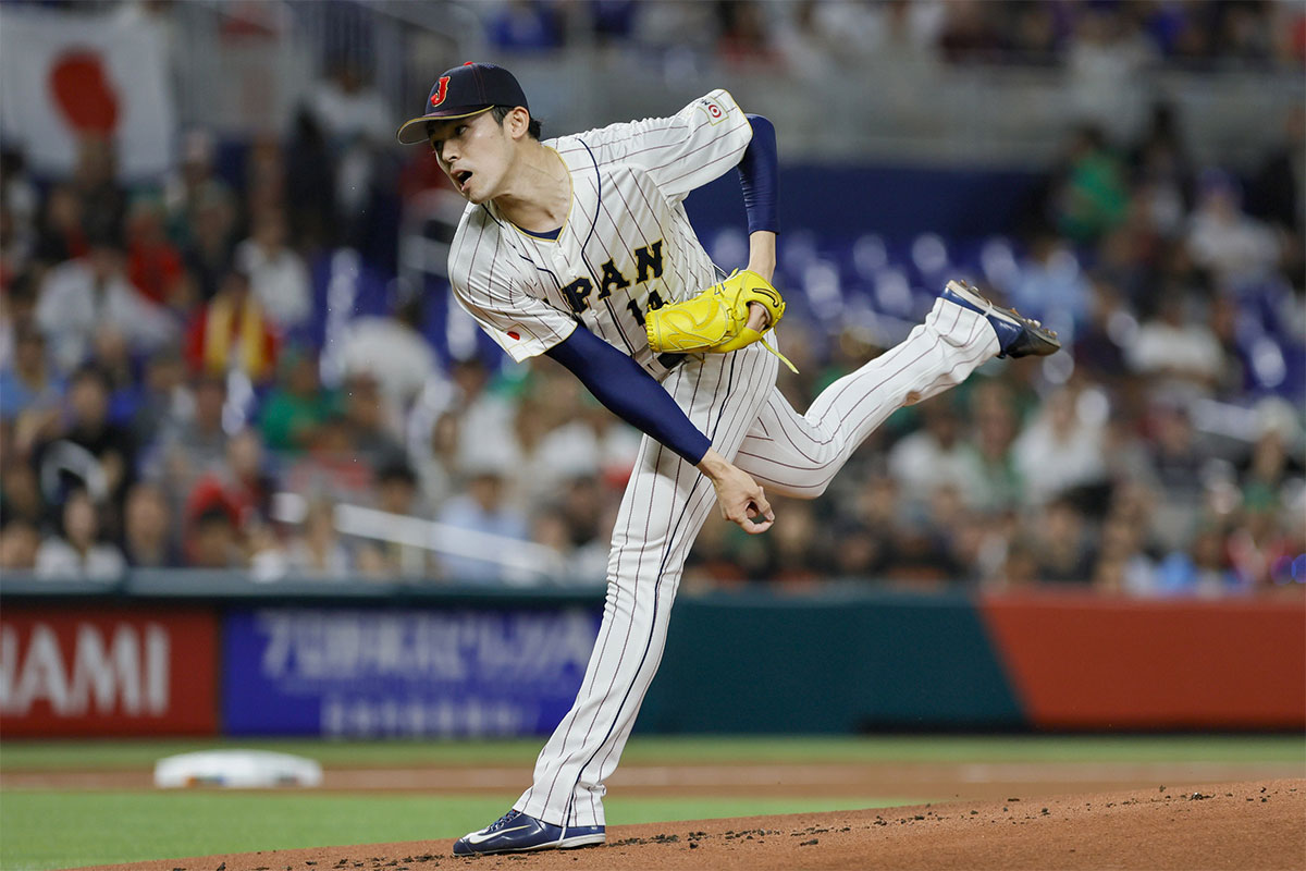 Japan starting pitcher Roki Sasaki (14) delivers a pitch during the first inning against Mexico at LoanDepot Park.