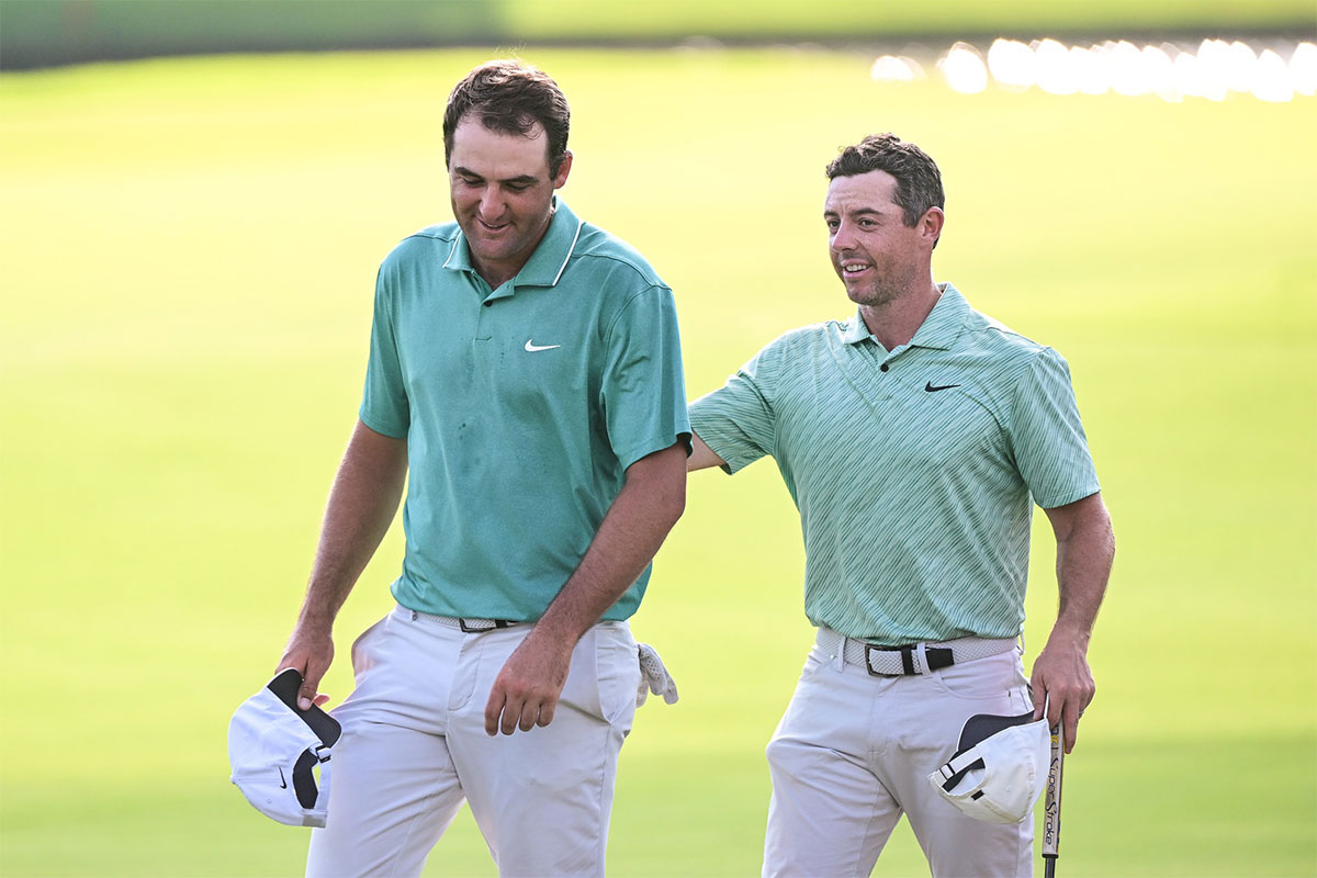 Scottie Scheffler and Rory McIlroy walk of the 18th green during the final round of the TOUR Championship golf tournament